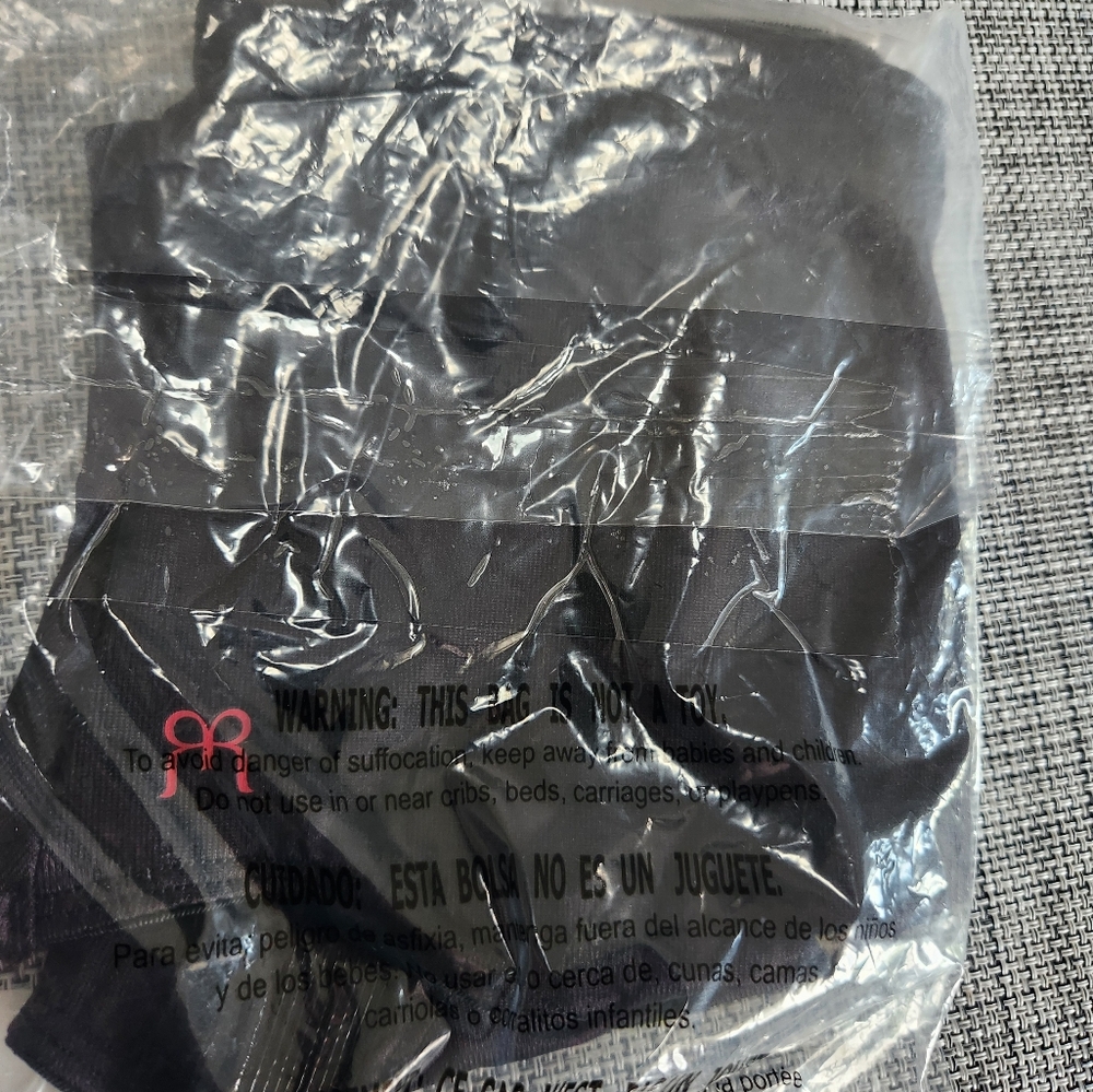 New in package Ruby Ribbon Shaping Brief, size Large. Black